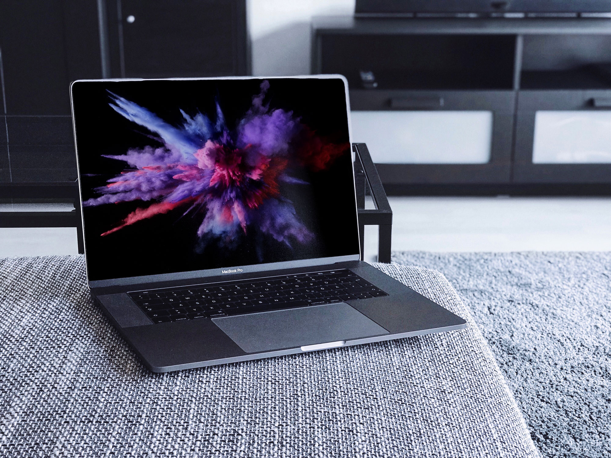 Free MacBook Pro Mockup on a Couch