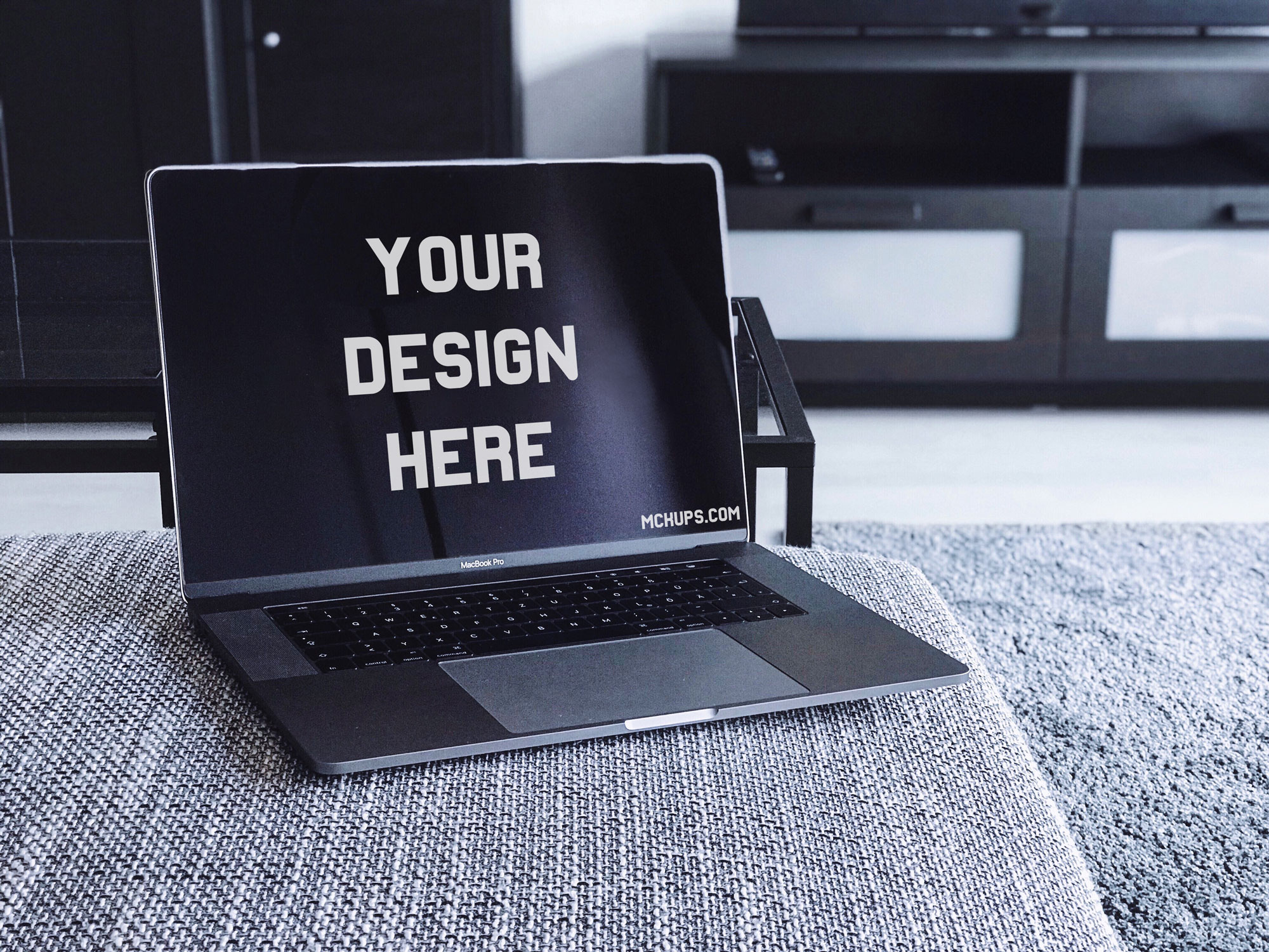 Free MacBook Pro Mockup on a Couch