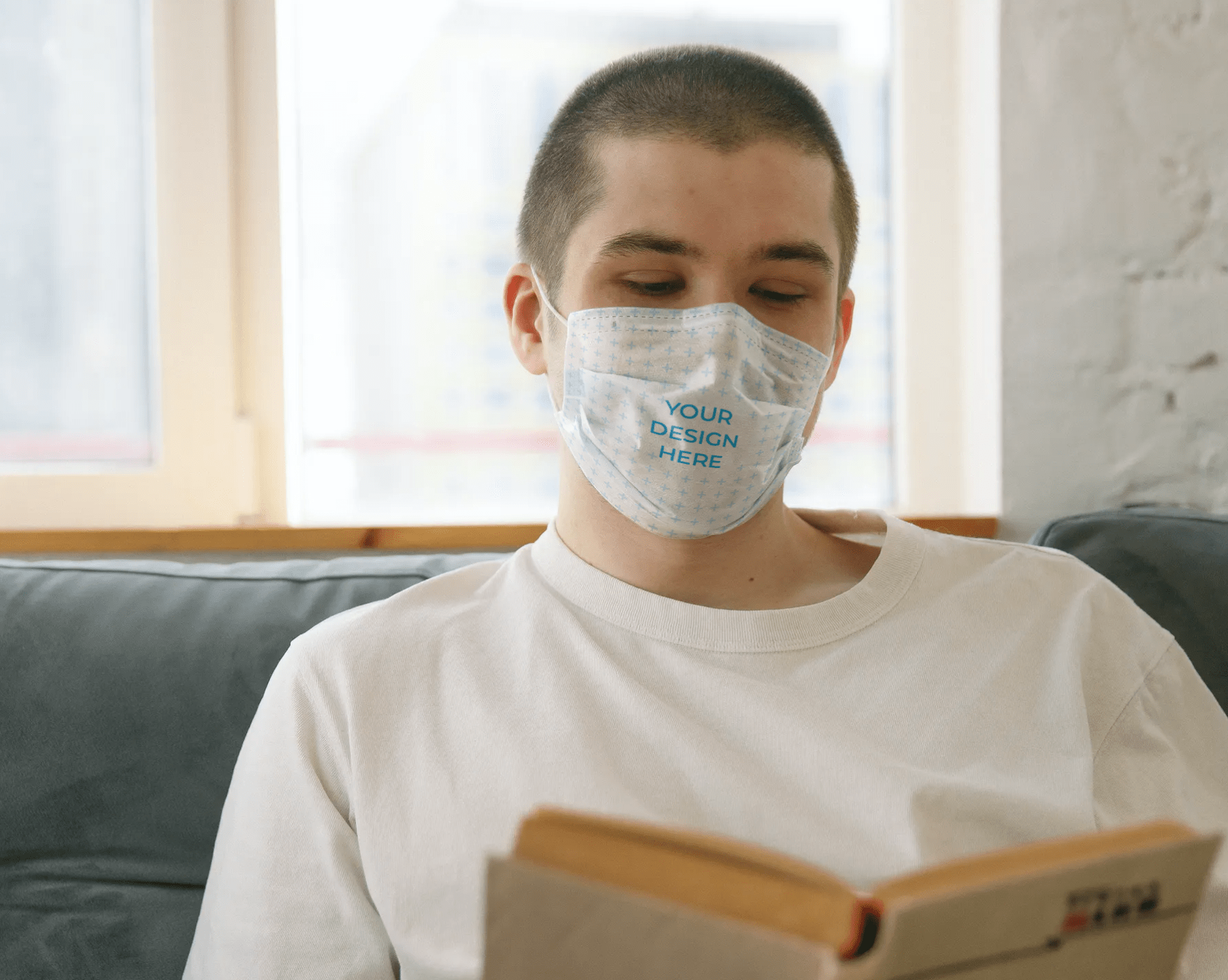 Download Man Wearing a Face Mask Reading a Book Free Mockup ...