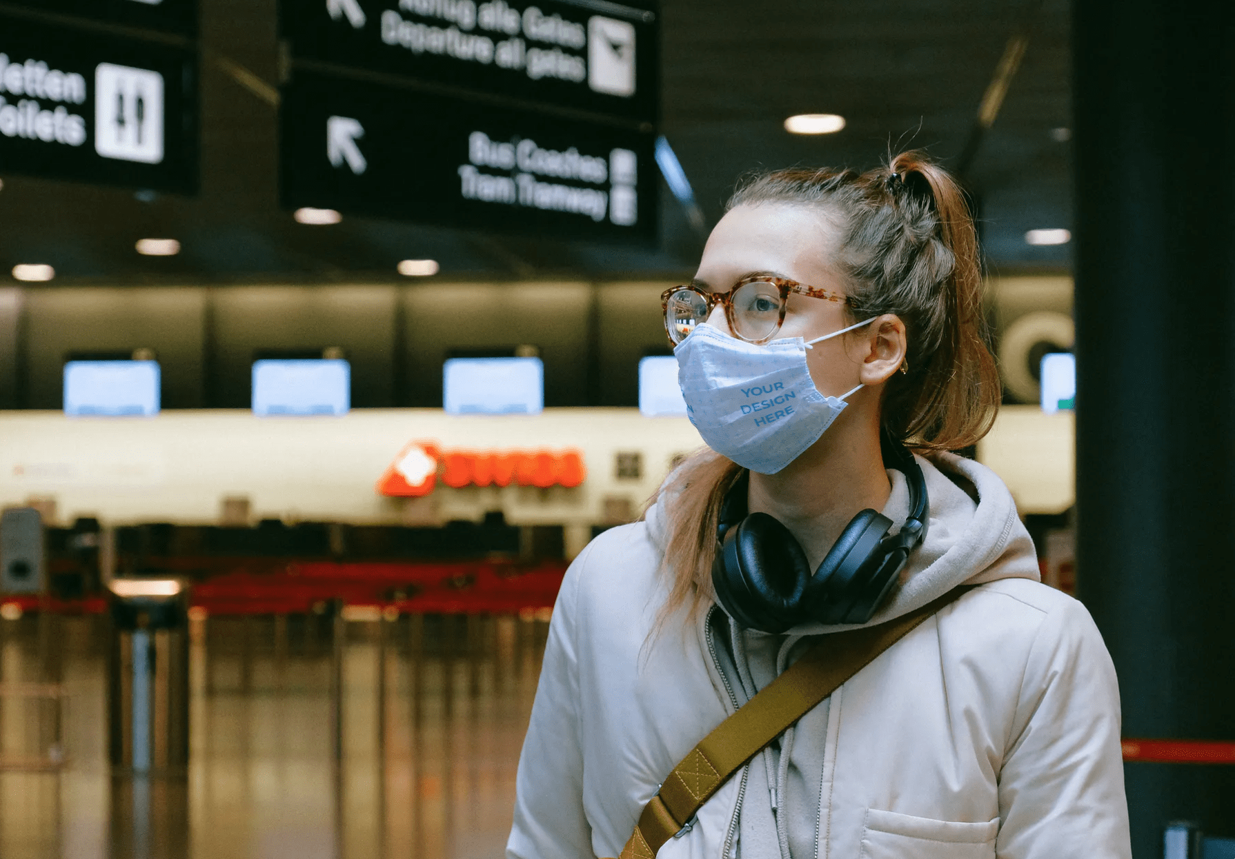 Download Woman Wearing a Face Mask at the Airport Free Mockup Generator - Free Mockup Download