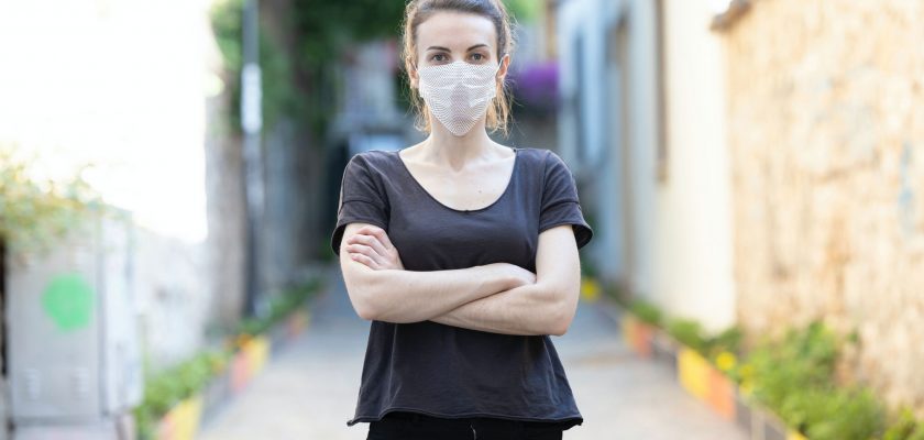 Young Woman Wearing a Face Mask Mockup with a Pattern