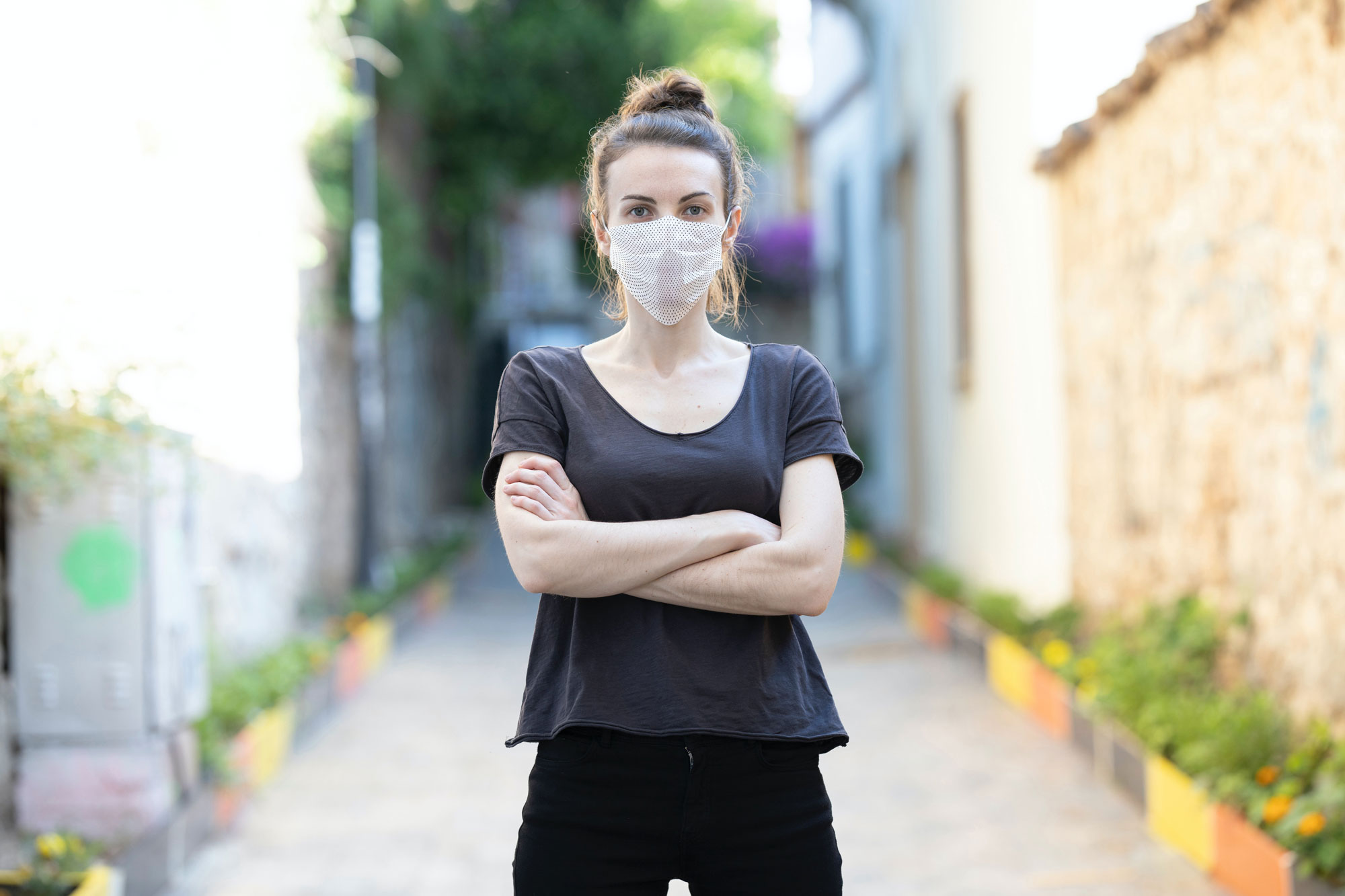 Young Woman Wearing a Face Mask Mockup with a Pattern