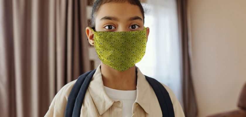 Little Girl Wearing a Face Mask Mockup