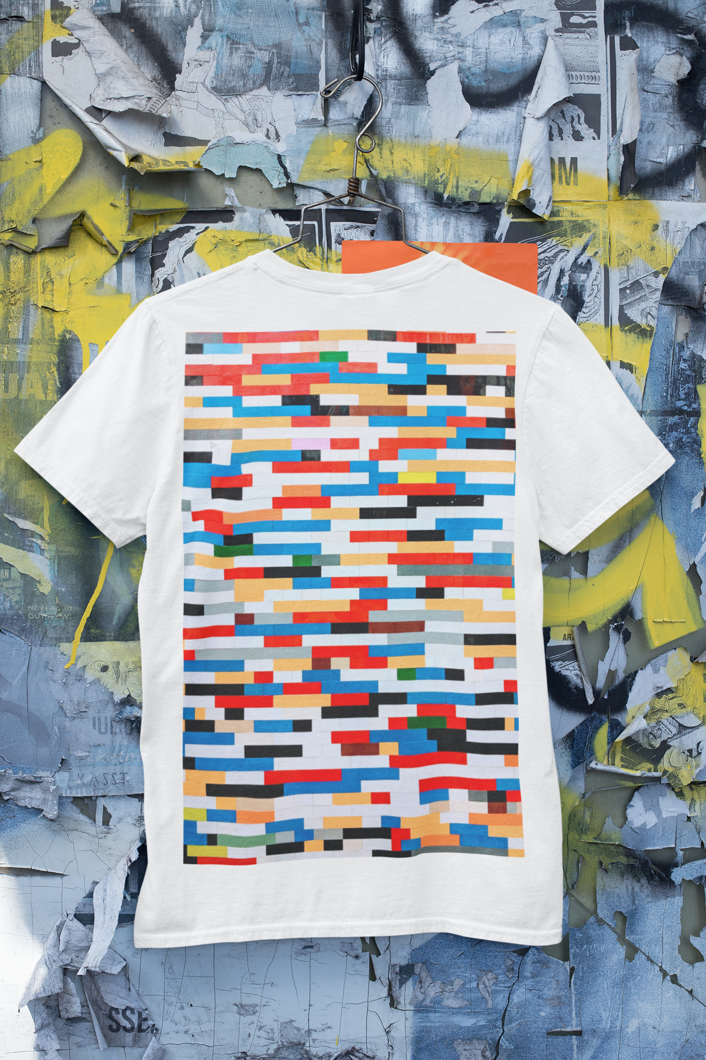 https://mckups.com/wp-content/uploads/2021/06/mockup-of-a-t-shirt-hanging-on-a-wall-with-old-posters-and-graffiti-m431.png