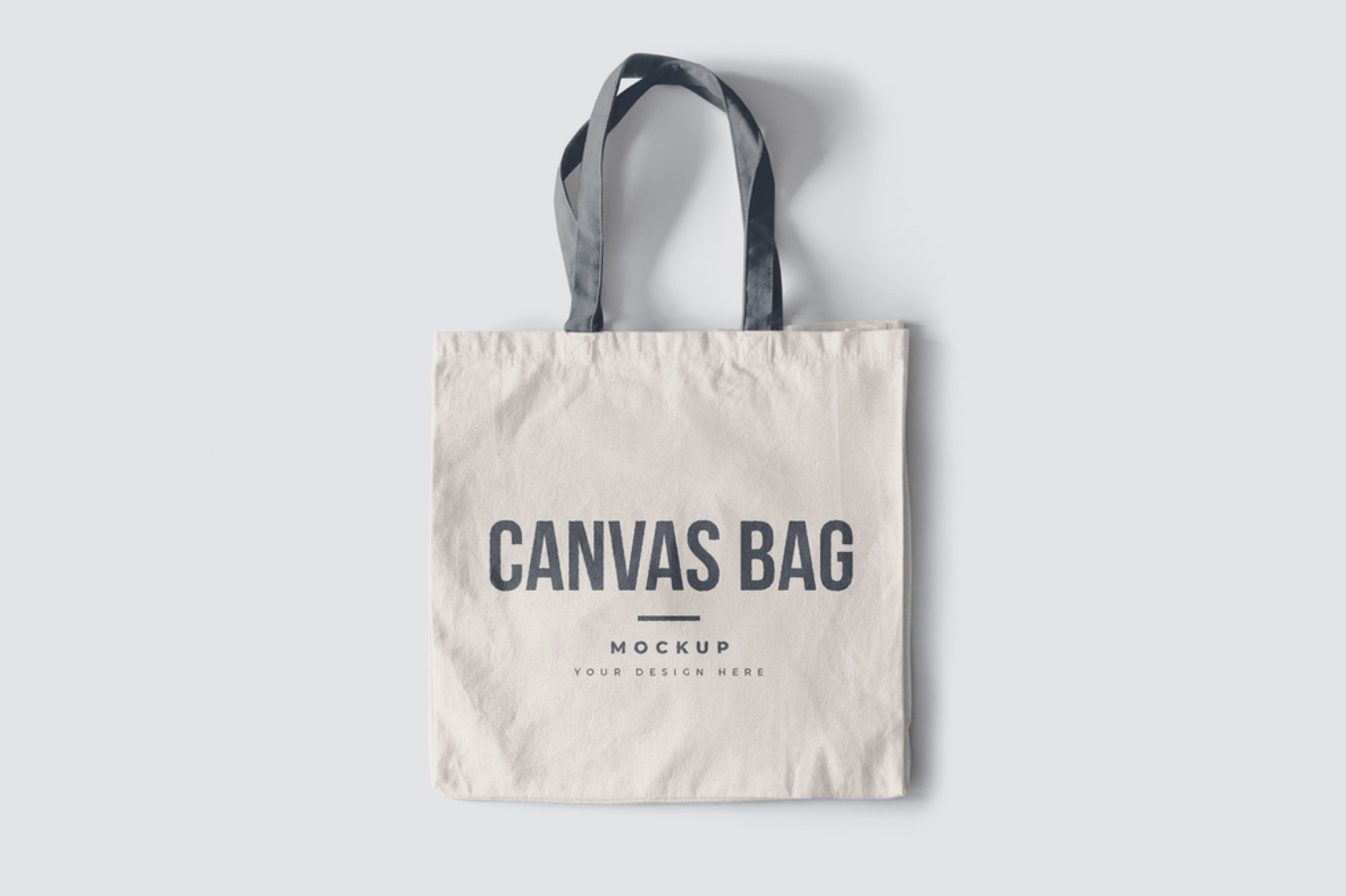 Canvas Tote Bag lying on a table with customizable designs on it.