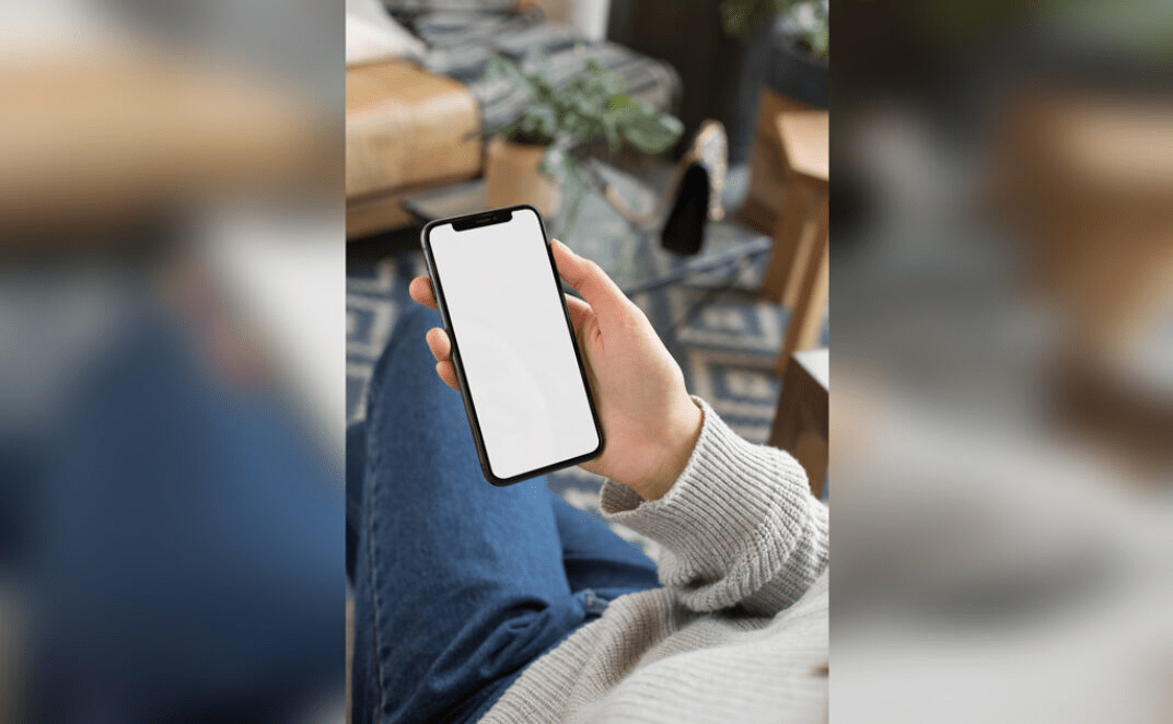 iPhone 11 Pro in woman's hand mockup generator