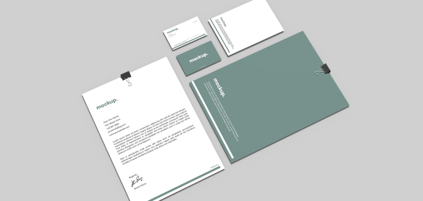 Minimalist stationery mockup set including letters, business cards, and an envelope on a neutral background.