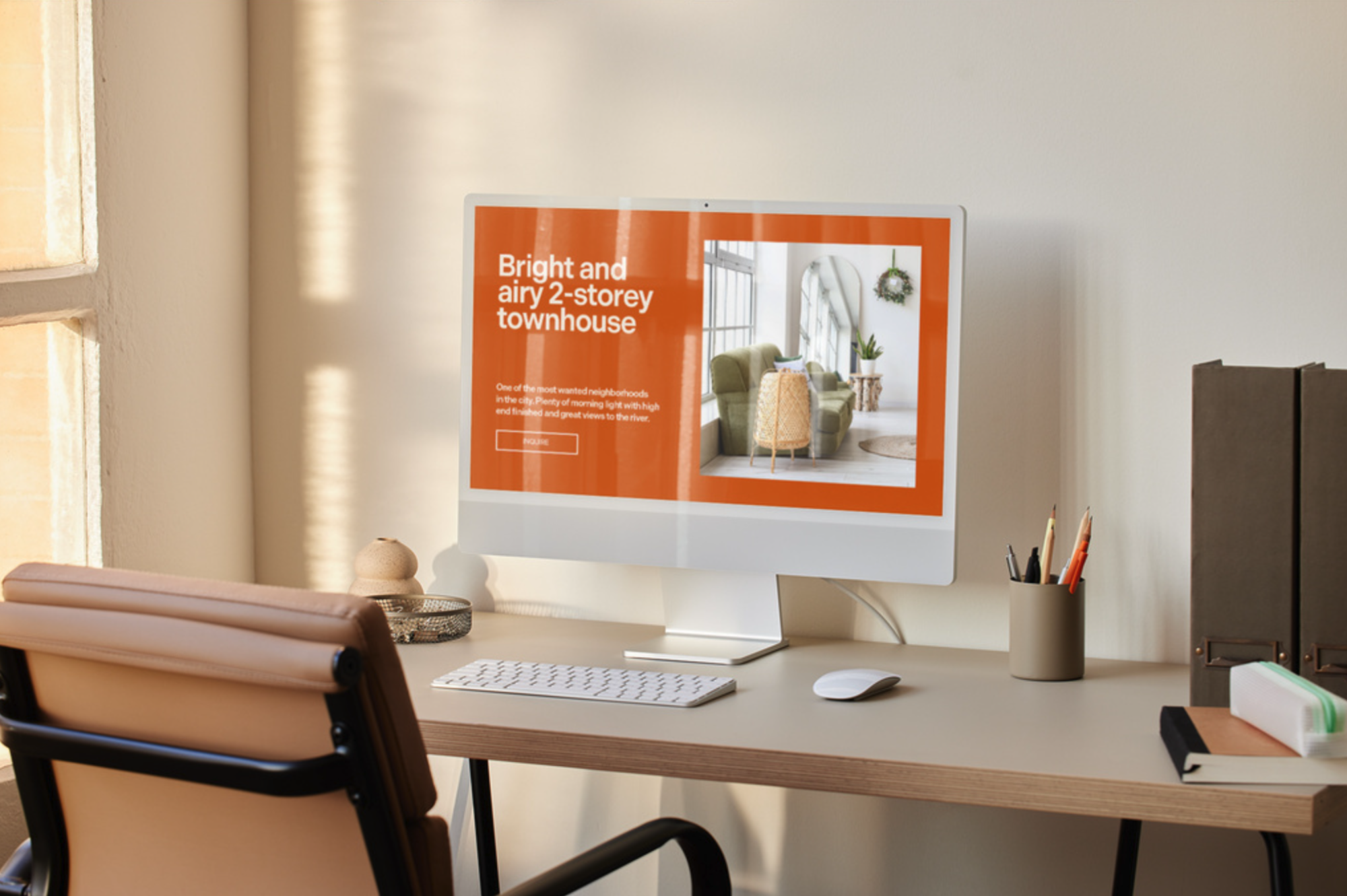 Free website mockup featuring a desktop monitor in a minimalist workspace with customizable design display.