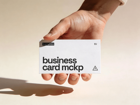 Free business card mockup in hand