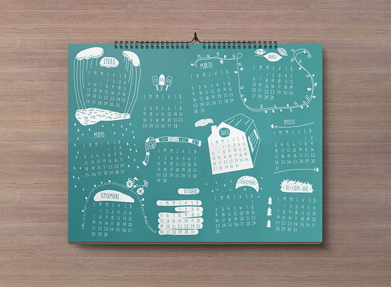 Landscape wall calendar mockup with a teal yearly calendar and white illustrations on a wood background