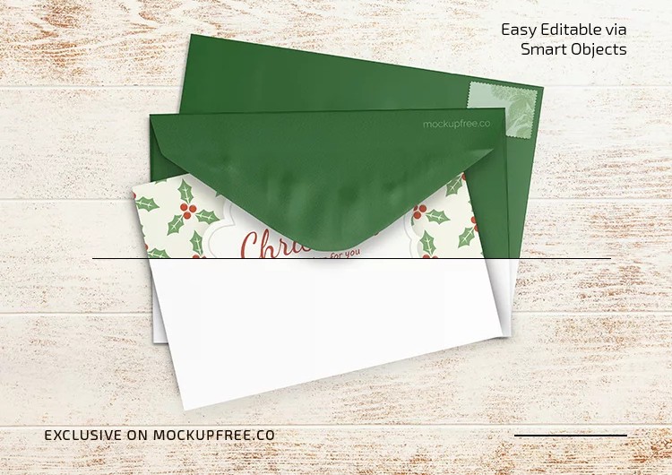 Free Christmas mockup PSD &mdash; printed Christmas card with a green envelope, top view