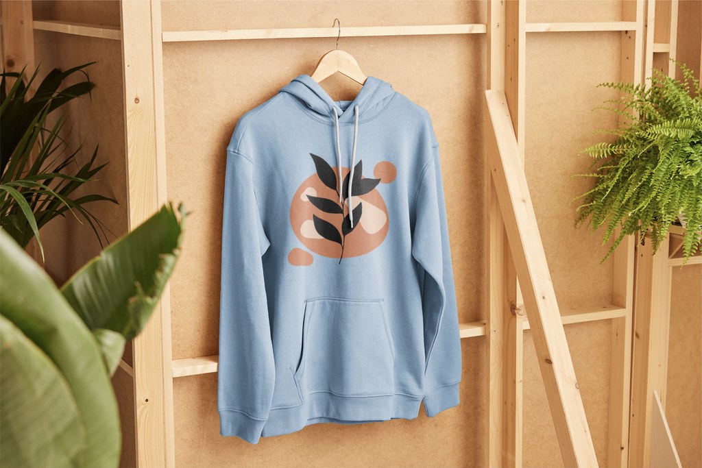 Free hoodie mockup PSD — hoodie and tank top flat lay on wood