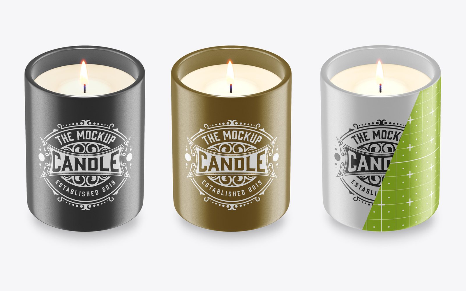 Free candle mockup PSD — lit glass candle tumbler in black, gold and silver finishes with a vintage label