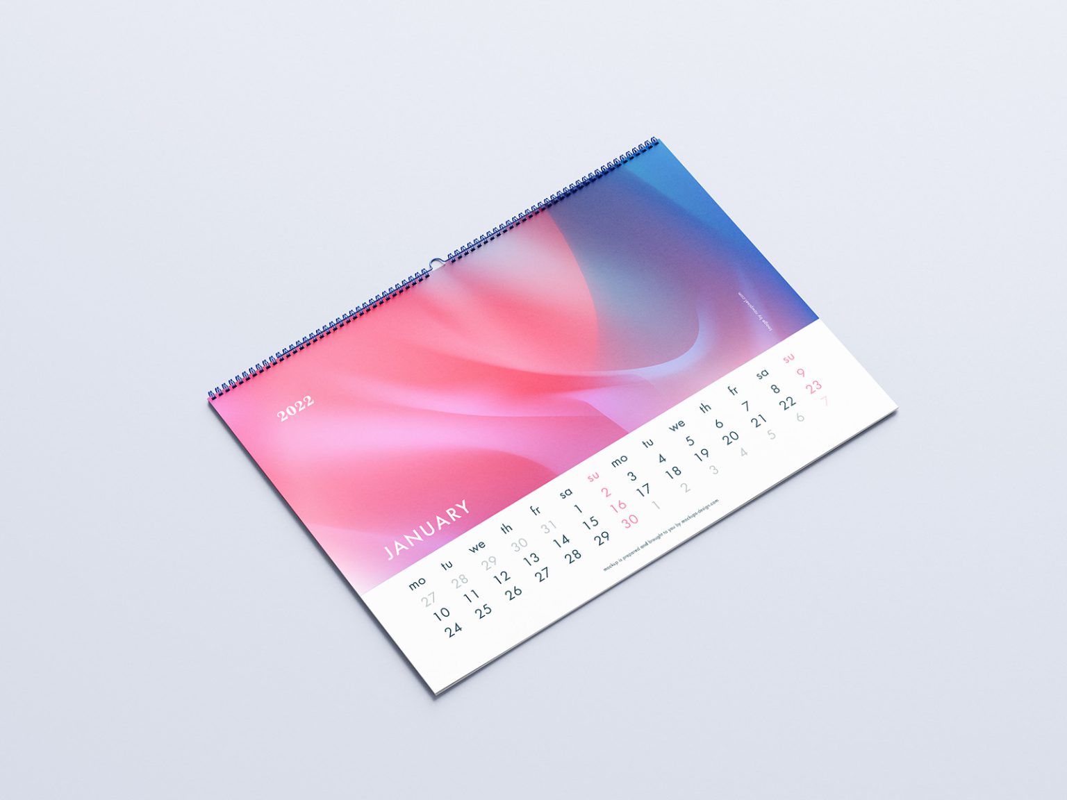 Free calendar mockup PSD — horizontal A3 wall calendar with spiral binding on a flat surface